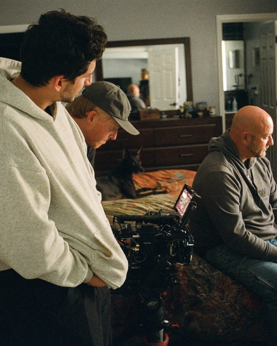 The crew filming an interview in a living room.