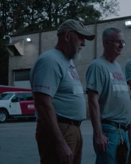 Team Rubicon volunteers at the trucks before a shift.