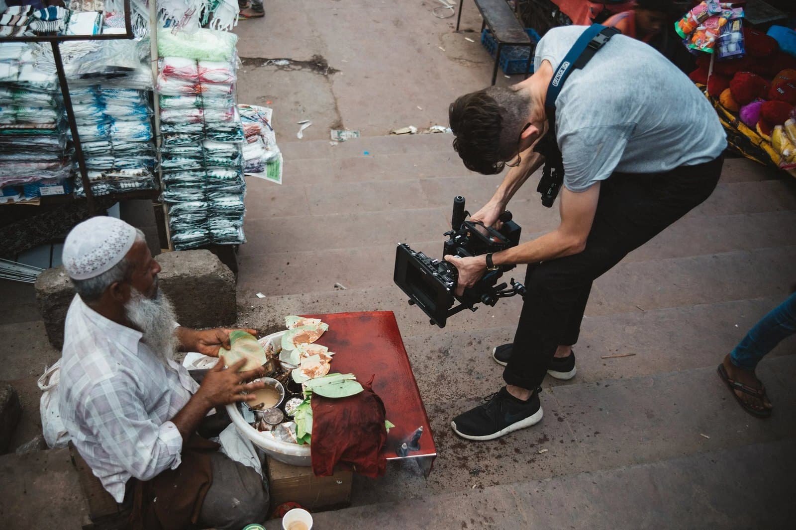 The crew filming a food vendor at a market in India.