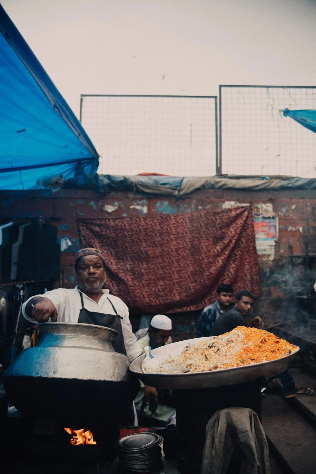 A cook at a street stall in India.