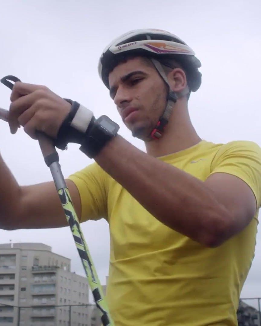 Victor Santos with his ski poles, training on the street.