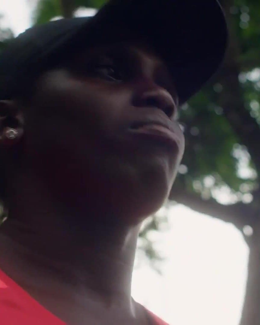 A woman in a cap, in profile.