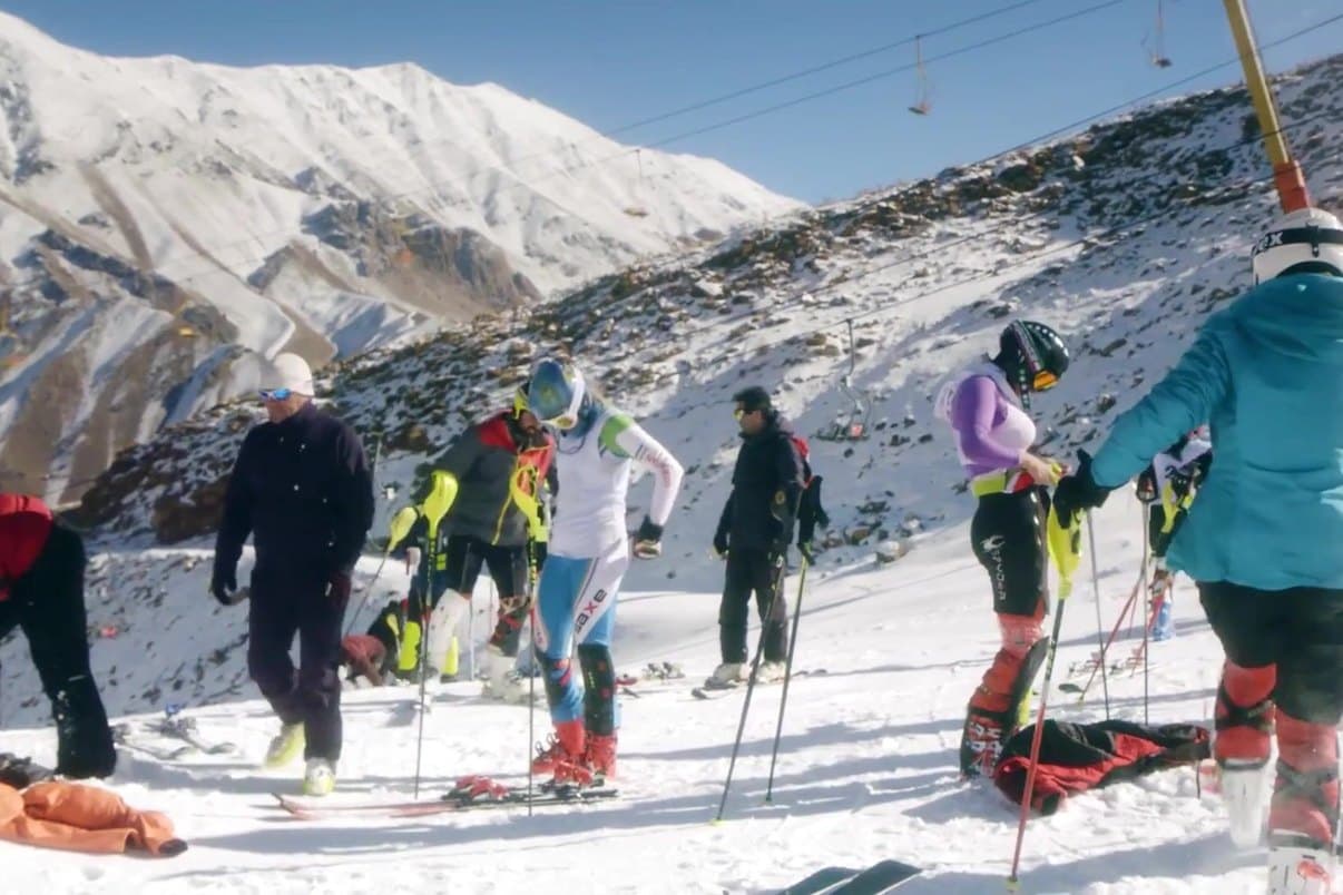 Skiers gathering on a mountain slope in Iran.