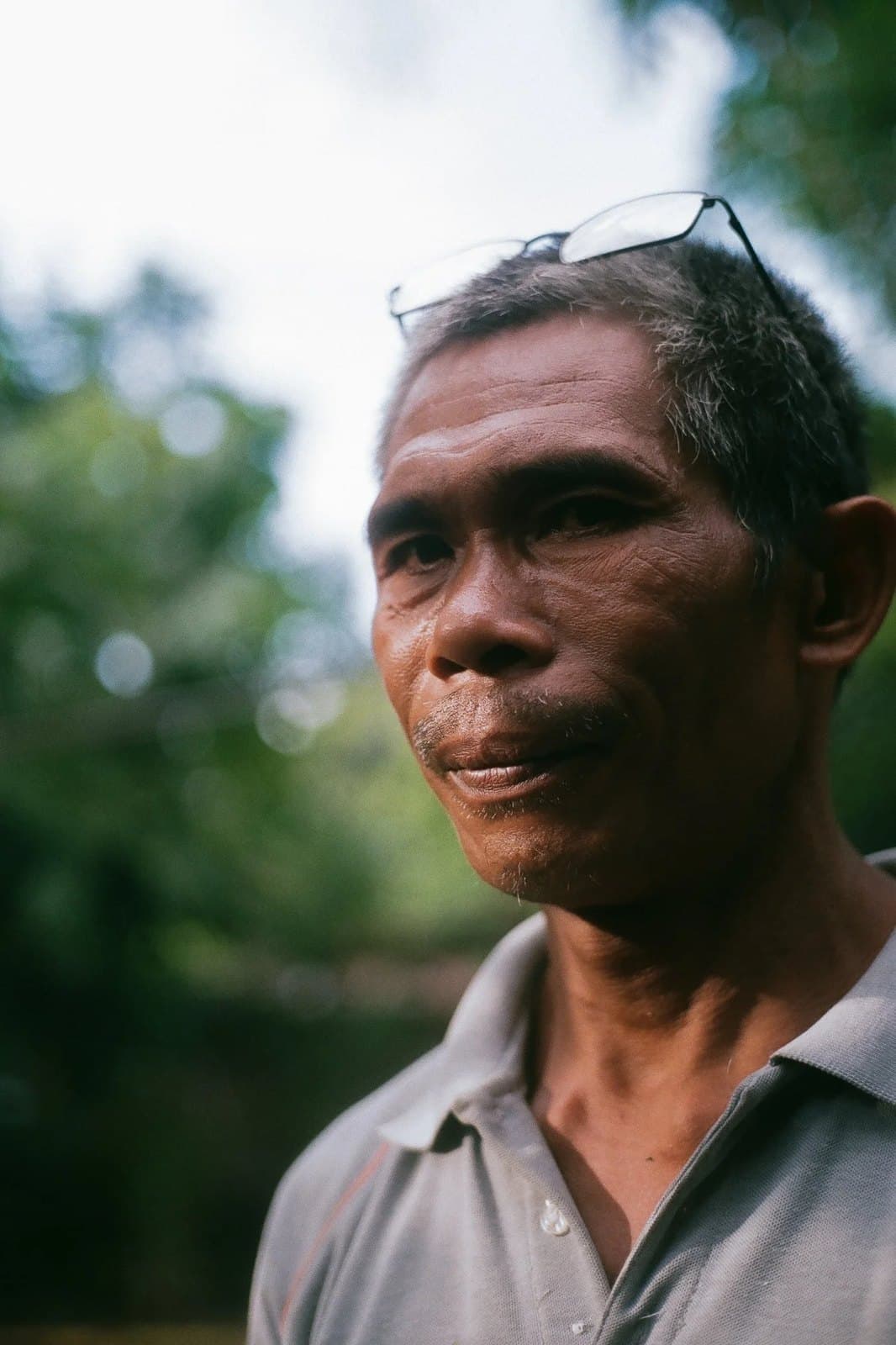 A farmer in a grey shirt, on 35mm film.