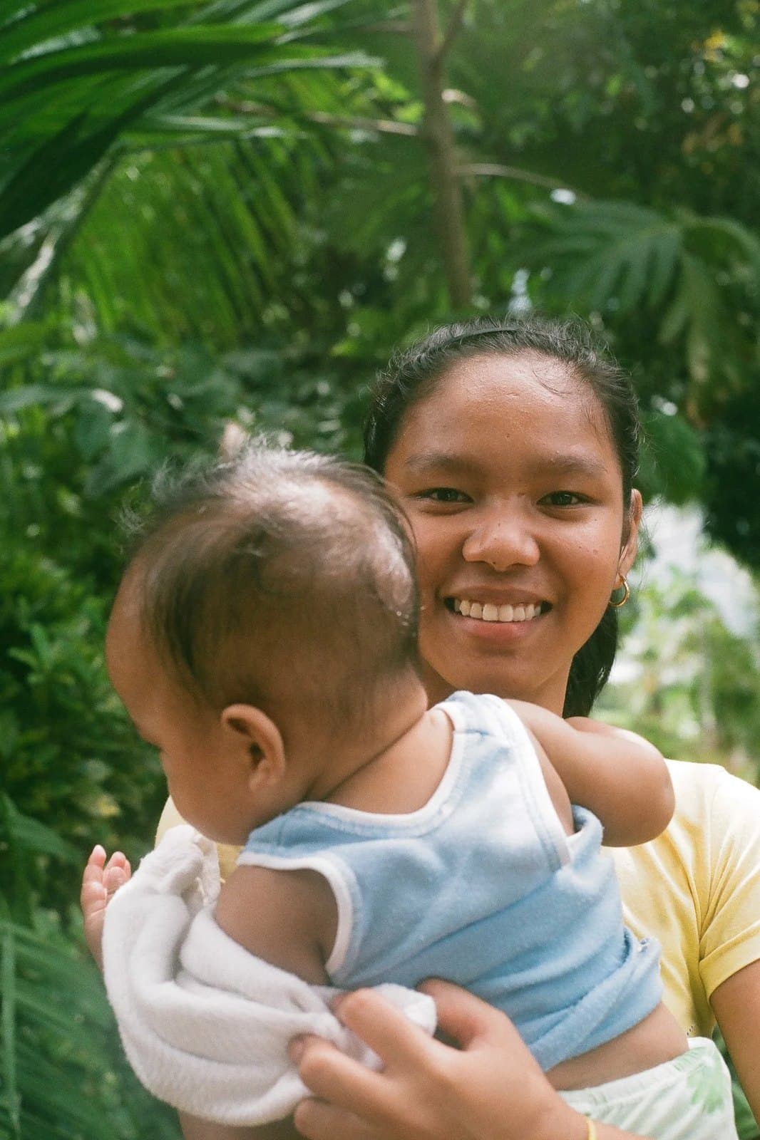 A young mother holding her baby.