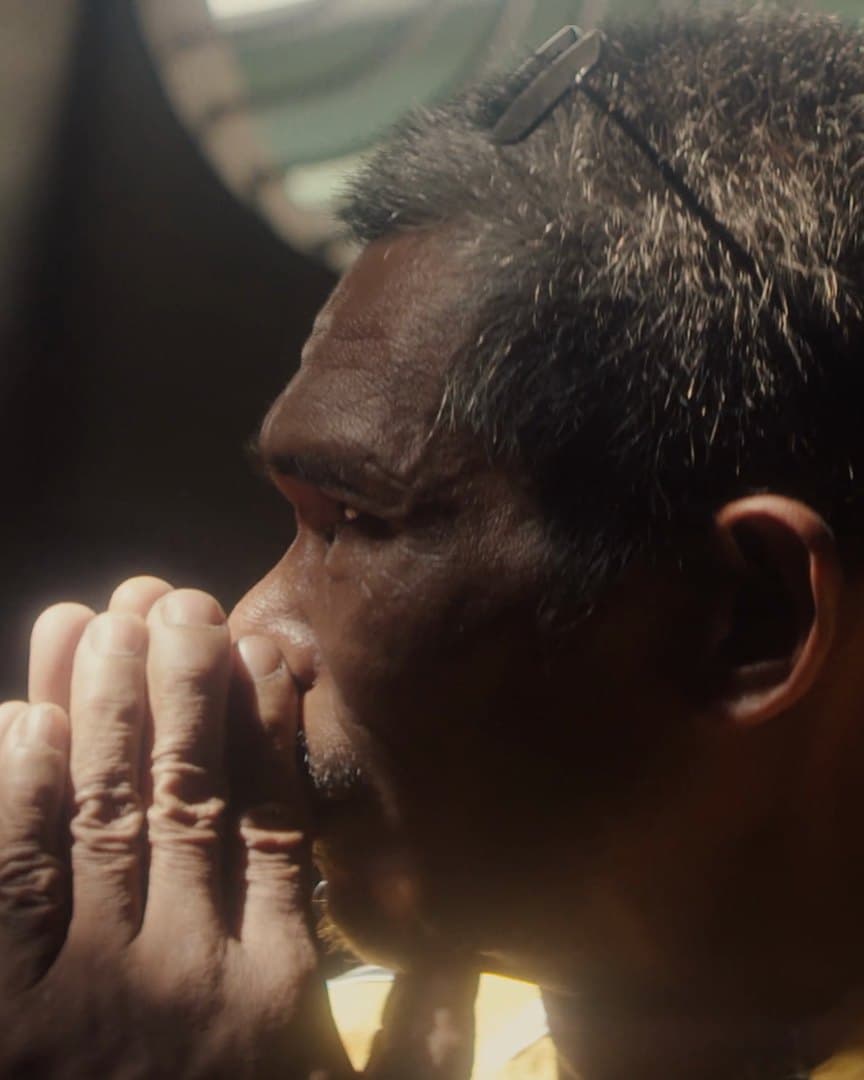 Virgilio praying during the operation.