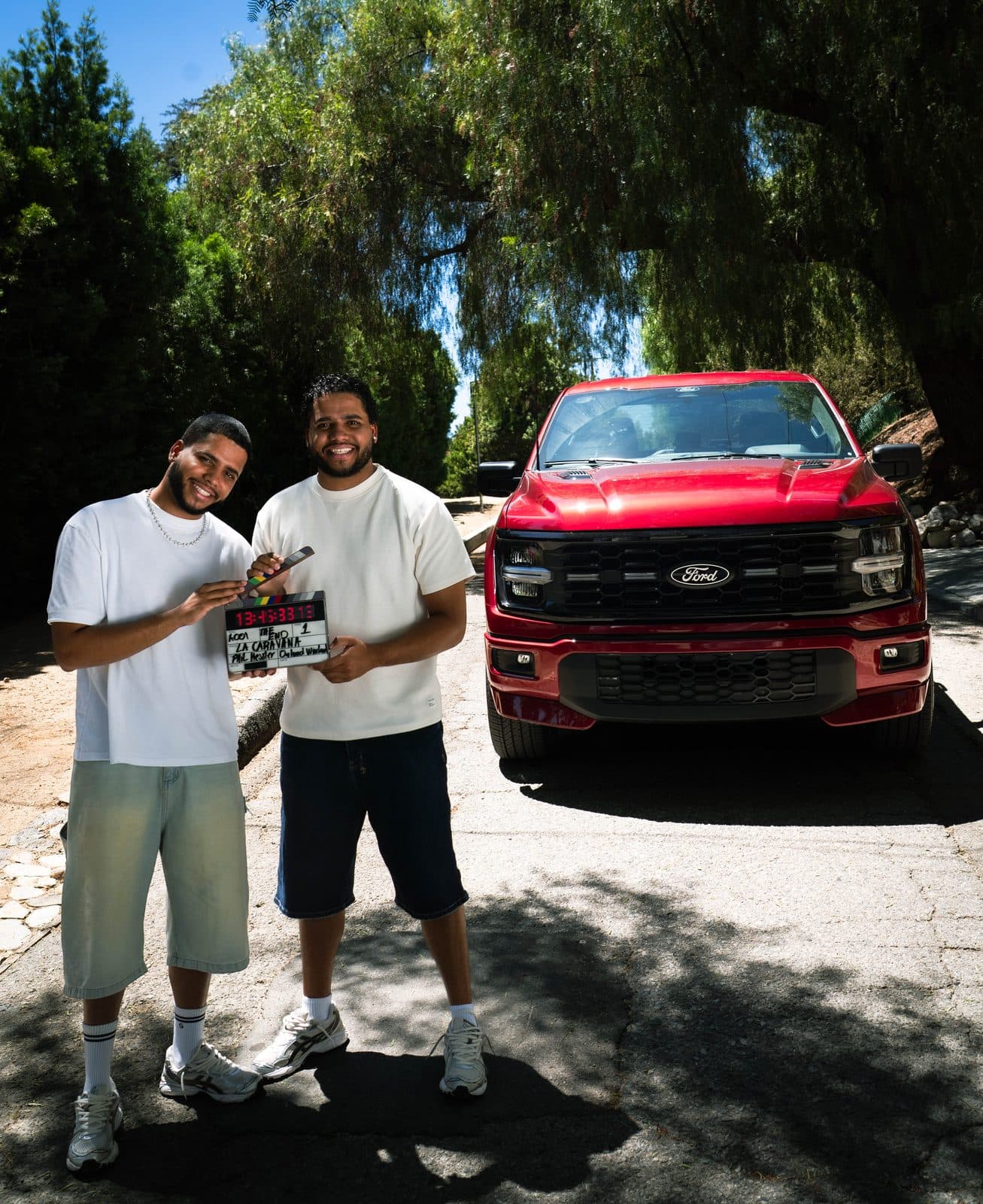 The twins with the F-150 under the trees.