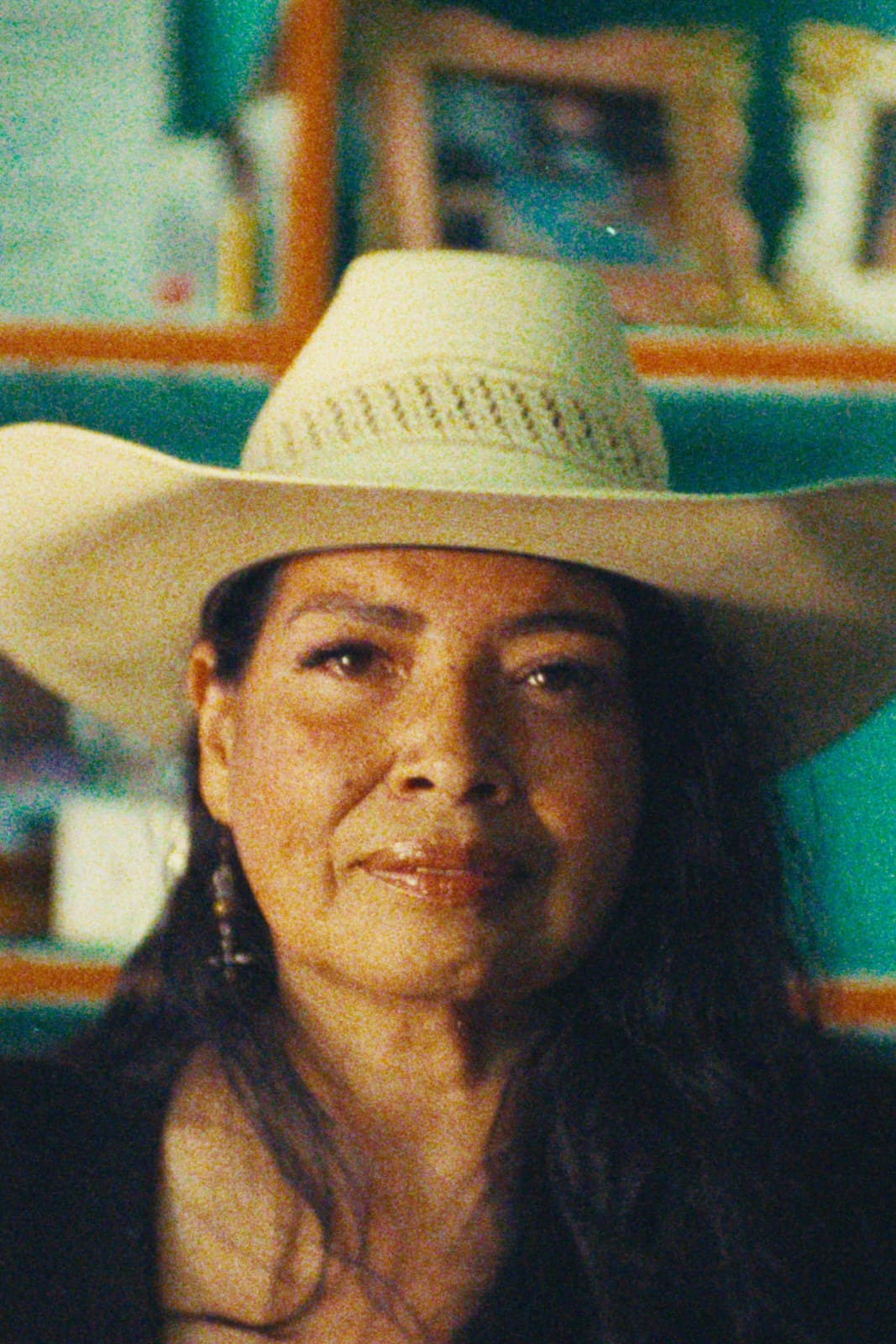 A woman in a straw cowboy hat, Dallas.