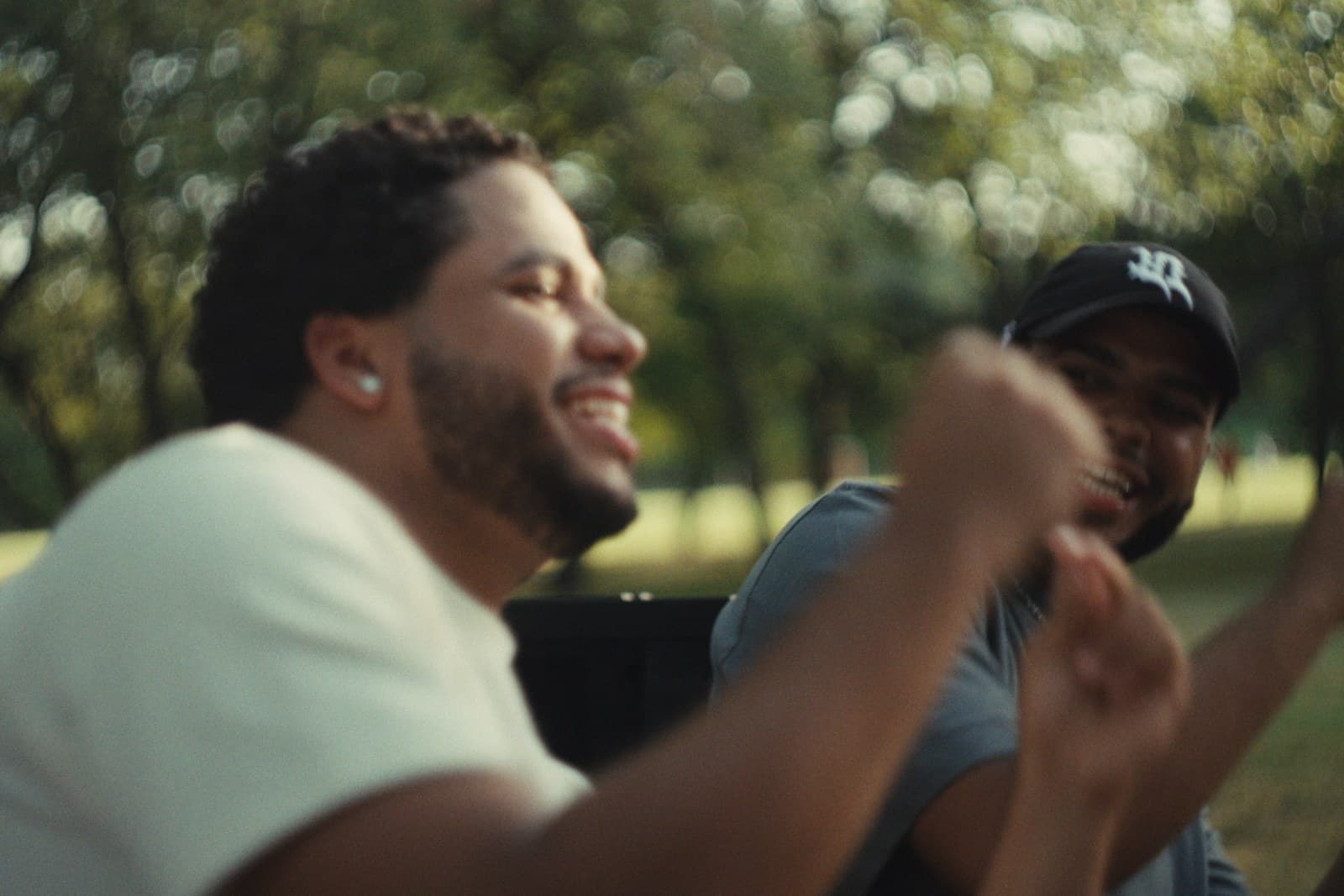The twins laughing and dancing in a Dallas park.