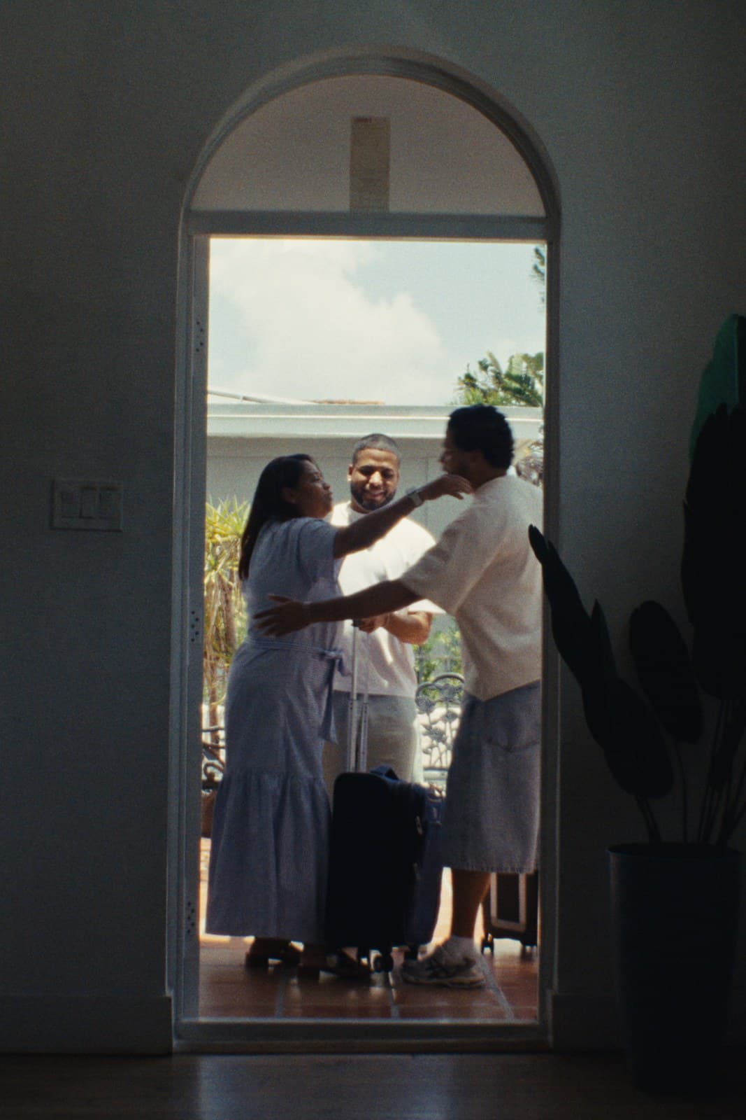 The twins greeted by their mother in a Miami doorway.