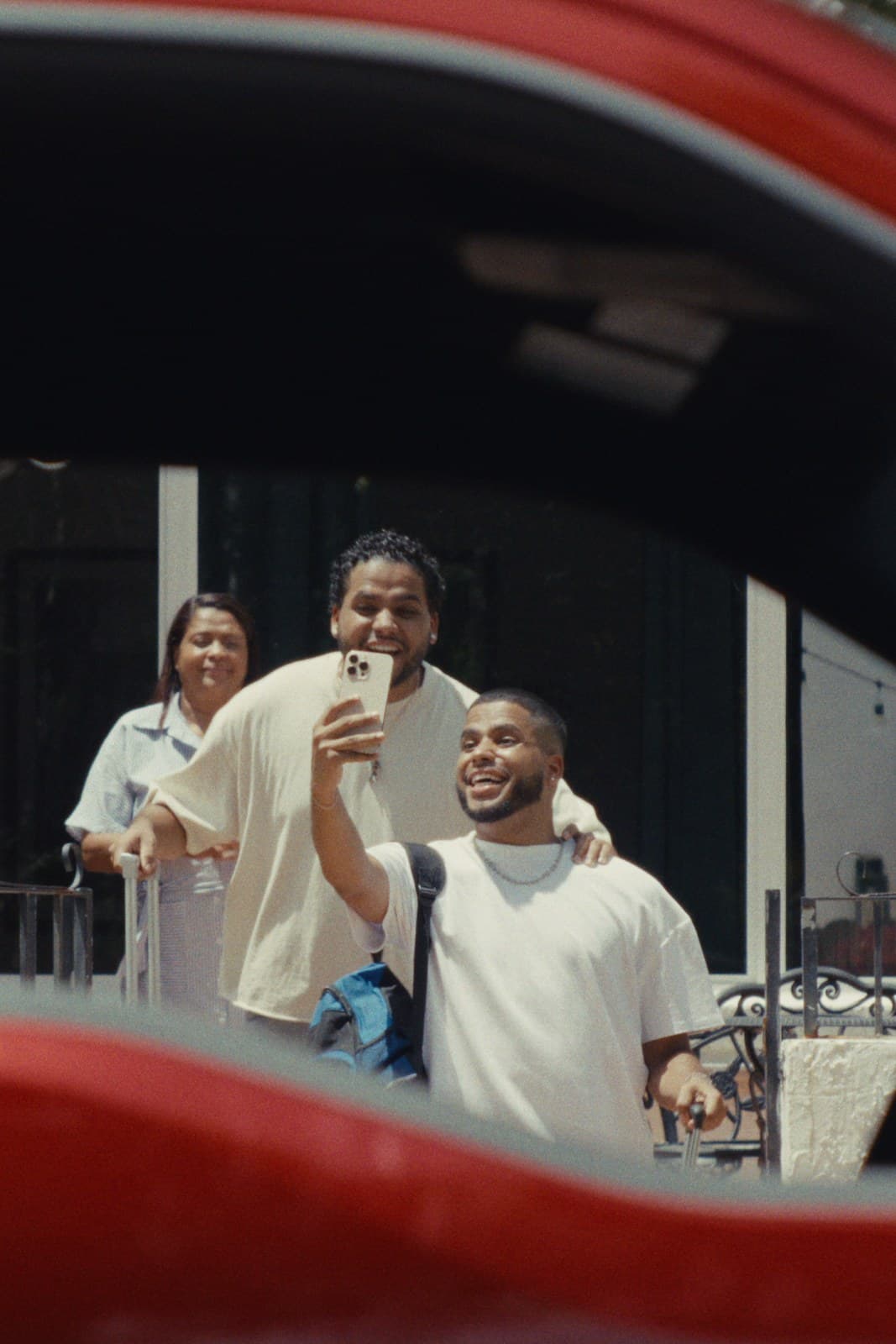 The twins and their family taking a selfie, seen through the F-150’s window.