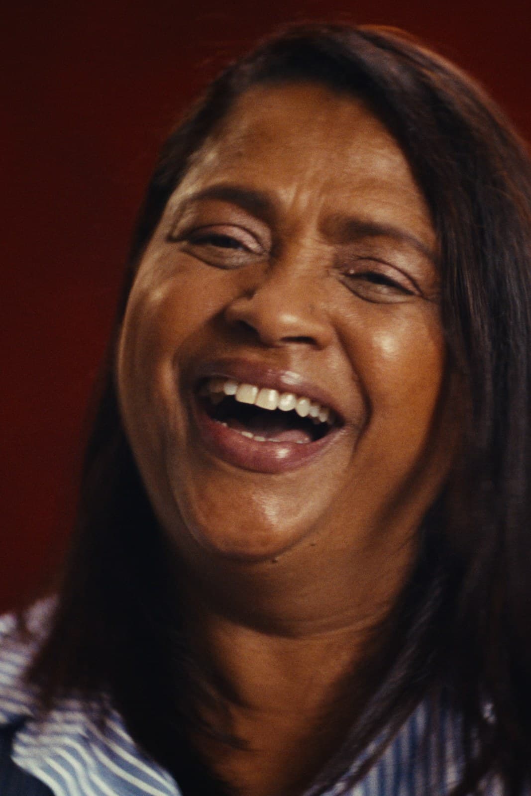 The twins’ mother laughing in the interview.