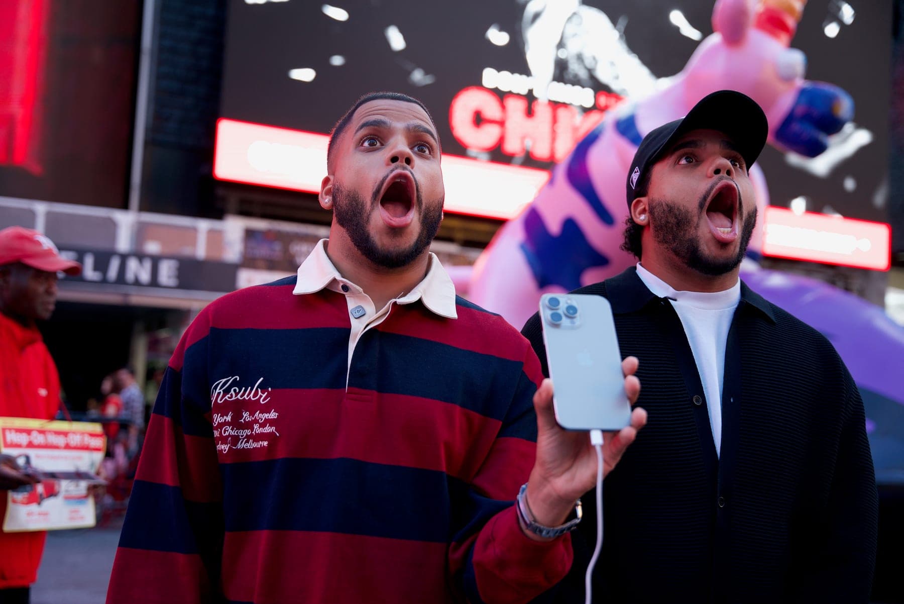 The Ventura Twins looking up in amazement in Times Square.