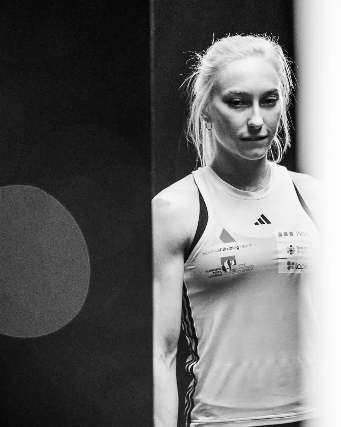 A climber in black and white, waiting in the wings.