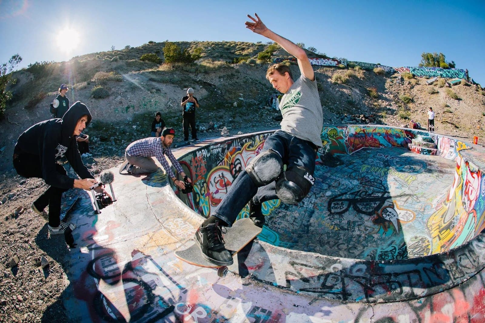 Tony Hawk skating the Nude Bowl, a crew filming from the deck.