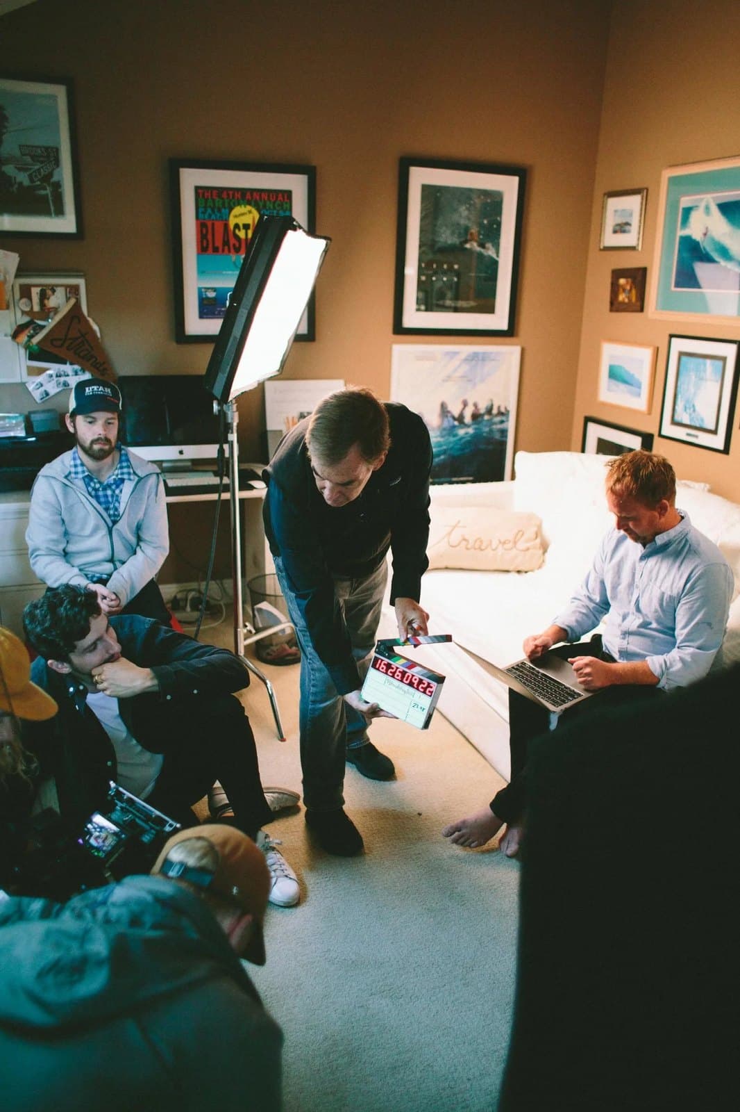 Setting up an interview in a room full of framed photographs.