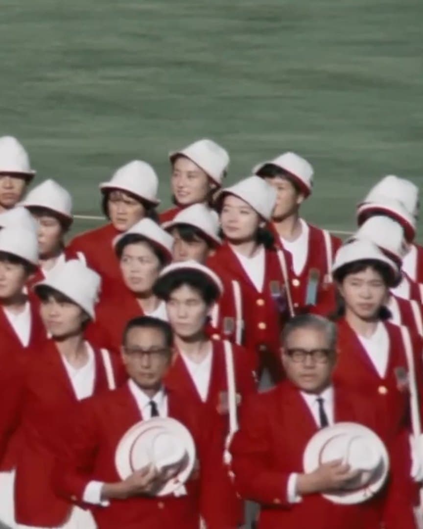 A national team in red jackets at an opening ceremony, from the archive.