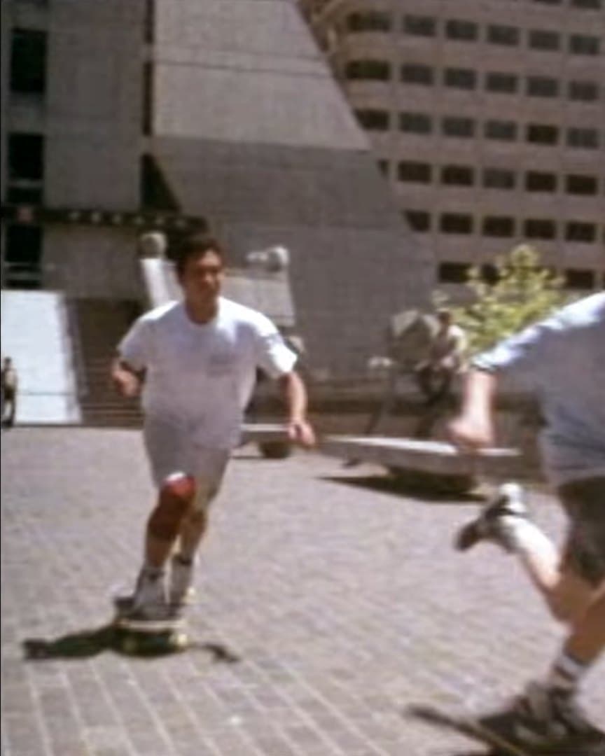 Skaters on a city plaza, from the archive.