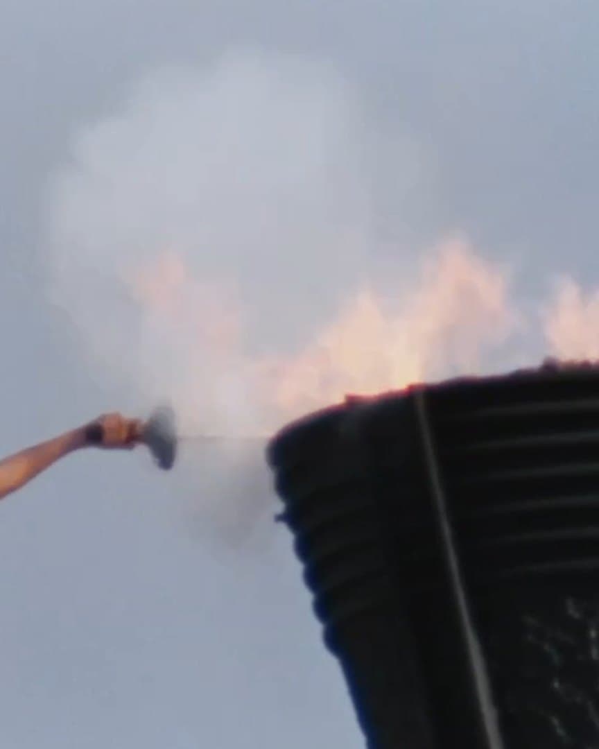 The Olympic cauldron lit, from the archive.