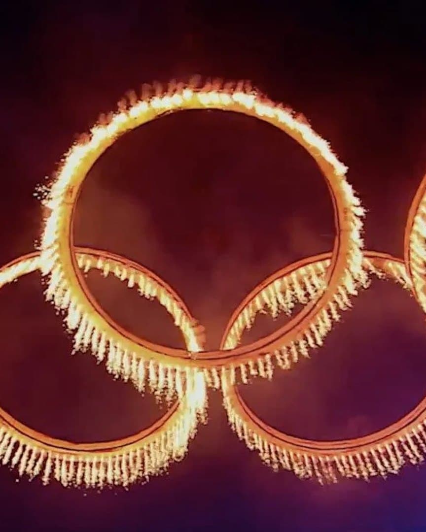 The Olympic rings drawn in fire.