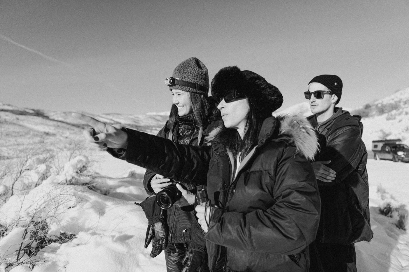 Director pointing out the frame in the snow
