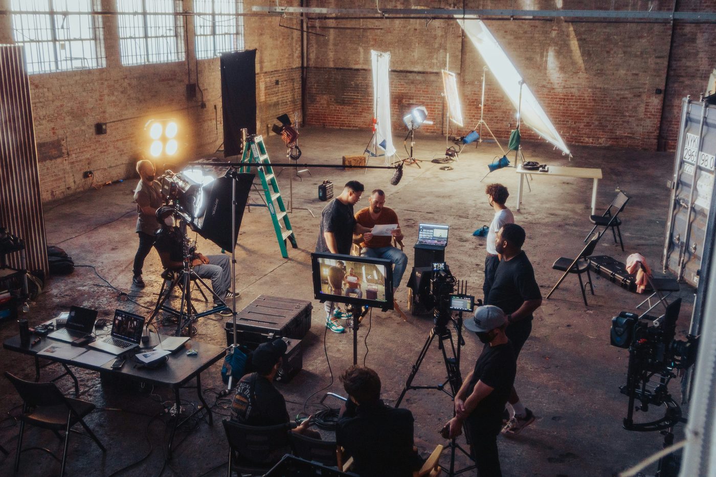 A lit warehouse set mid-setup