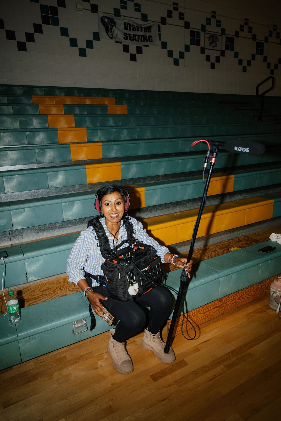 Operator with a rig on the gym bleachers