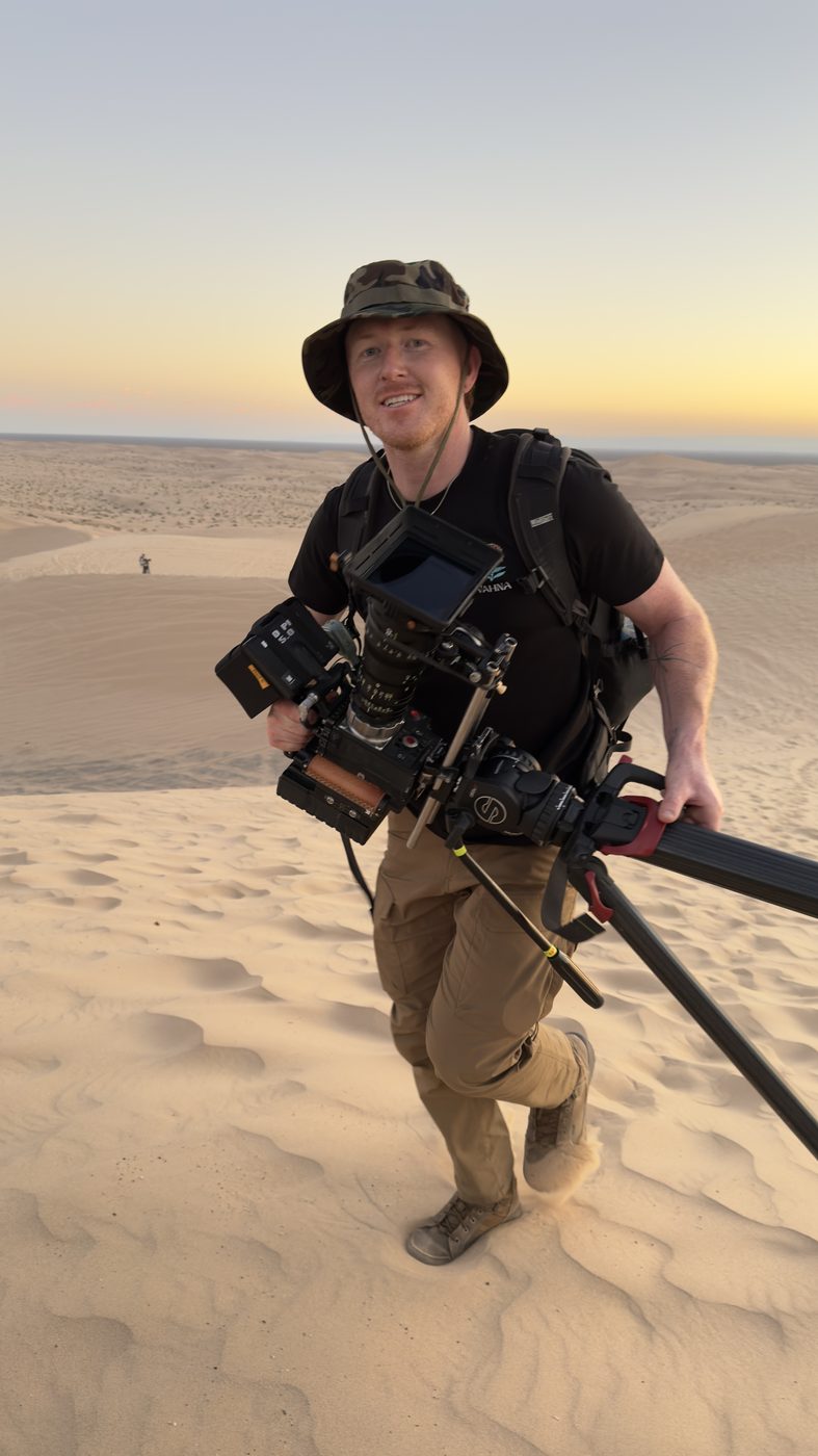 Operator carrying the rig across the dunes