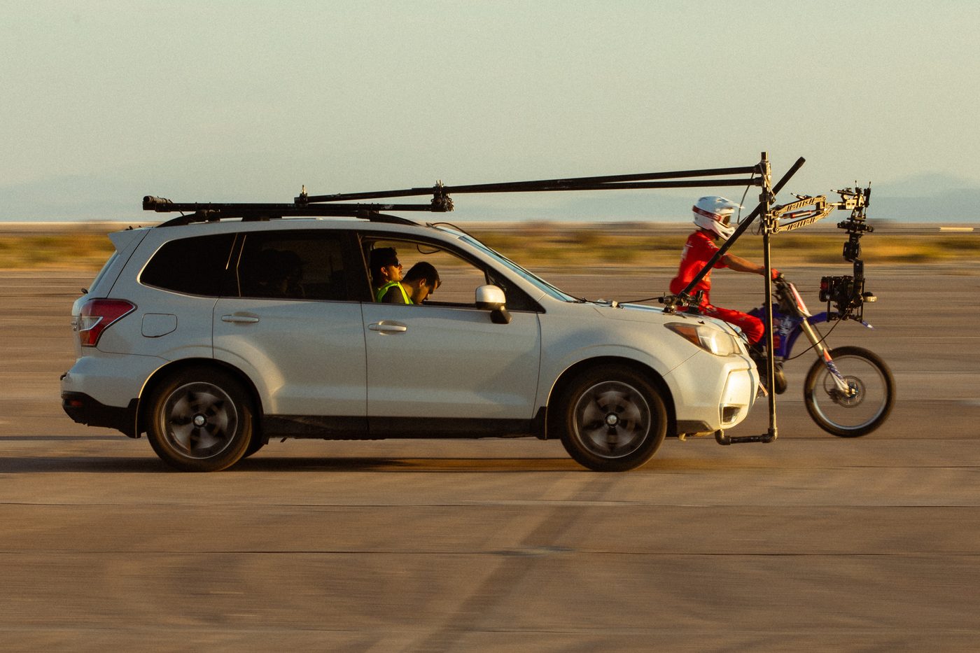 Camera car tracking a motorbike on the airfield